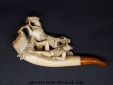 A cased Meerschaum pipe with figural horse and thrown rider decoration