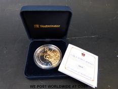 A Guernsey silver proof £5 coin commemorating The Crown Jewels,