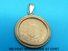 A 9ct gold pendant set with a 2002 gold half sovereign (5.