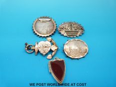 Three hallmarked silver brooches one depicting Gloucester cathedral,