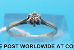 A 9ct gold ring set with a diamond solitaire (size N)