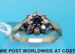 A 9ct gold ring set with a sapphire surrounded by cubic zirconia (size O)