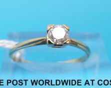 A 9ct gold ring set with a diamond measuring approximately 0.