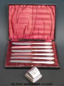 A cased set of six hallmarked silver handled knives and a silver ring box