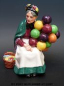 A Royal Doulton figurine Old Balloon Seller HN 1315