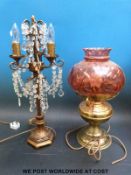 An oil lamp style table lamp and one other