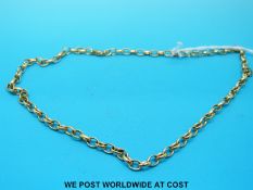 A yellow metal necklace made up of oval links, marked 18k (18.