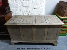 A large oak coffer (width 142cm, depth 65cm,