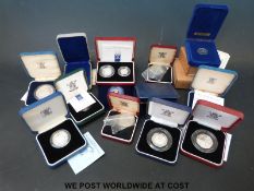 Fifteen various silver card coins including crowns, 50 pence pieces, small coin sets etc.