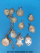 A hallmarked silver charm bracelet with 11 hallmarked silver fobs