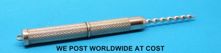 A 9ct gold engine turned tooth pick (6.