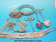 Two white metal spoons marked 800, two silver brooches, a hallmarked silver bangle,