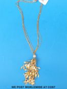 A large necklace by Grosse (Christian Dior) with strands joining at a sphere set with crystal with