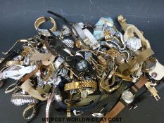 Over eighty various ladies and gentleman's wristwatches.