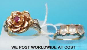 A yellow metal ring marked 585 set with a ruby and a 9ct ring set with quartz