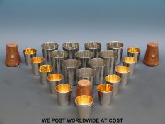 Three cased sets of stacking hunting cups together with a set of ten further cups