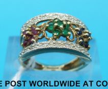 A 9ct gold ring set with diamonds, emeralds,