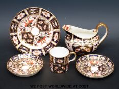 A Royal Crown Derby 2451 pattern coffee can, two saucers,