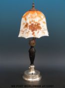 An Art Deco bakelite and hallmarked silver table lamp with hammered design, Birmingham 1933,