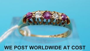 An 18ct gold ring set with alternating diamonds and rubies (size M)