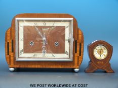 An oak cased mantle clock with Art Deco style decoration.