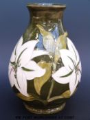 A Moorcroft vase in Bermuda Lily pattern (7.