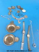 A silver necklace, silver charm bracelet,