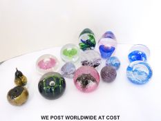 Fourteen named and signed glass paperweights by Caithness, Langham, Bohemia Glass Art,