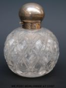A Victorian hallmarked silver mounted hobnail cut globe shaped dressing table scent bottle,