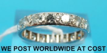 A white metal ring set with 17 diamonds each measuring approximately 0.