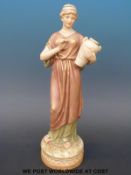 A Royal Dux figurine of a water carrier (33cm tall)