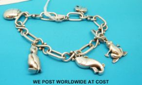 A Georg Jensen silver charm bracelet with frog, elephant, scarab beetle,