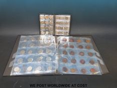 A collection of largely overseas coins in two folders