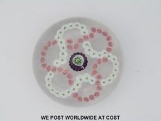 Clichy patterned millefiori glass paperweight with central green,