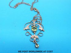 A Edwardian pendant set with seed pearls, peridot and garnets, marked 9ct (4.