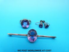 A 9ct gold brooch set with a large oval amethyst,