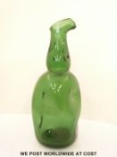 An early English green glass ewer with dimple decoration and broken pontil to base (33cm tall)
