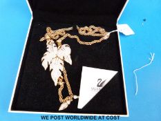 A boxed Swarovski necklace in large leaf design,