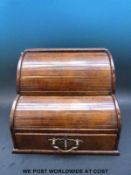 A 19thC burr tambour dressing table box having two tambour sections opening as the lower drawer is