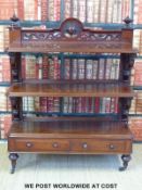 A William IV mahogany buffet with pierced shelf supports and gallery and three shelves with two