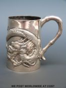 A Wang Hing Chinese silver tankard with embossed dragon decoration,