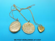 A hallmarked 15ct gold heart pendant set with a sapphire on yellow metal chain marked 9ct,