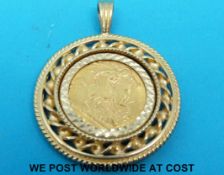 A 9ct gold pendant set with a 1914 gold half sovereign (9.