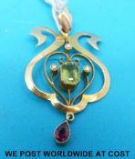 An Edwardian pendant, marked 15ct, set with seed pearls,