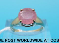A 9ct gold ring set with a round pink sapphire (size N)