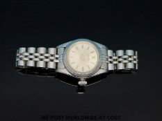 Rolex Oyster Perpetual ladies wristwatch with two-tone hands and baton numerals on stainless steel