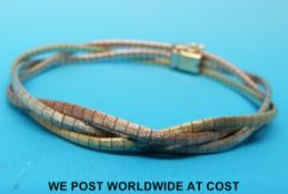 A 9ct gold tri-coloured bracelet with a matt finish (16.