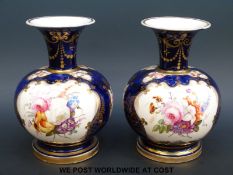 A pair of 19thC bulbous pedestal vases,