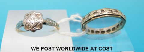 A yellow metal ring marked 9ct set with diamonds in a platinum setting and a yellow metal ring