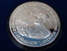 A Turks and Caicos World at War 100 crown silver coin (63.